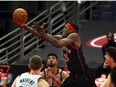 Toronto Raptors forward Pascal Siakam shoots the ball against Washington Wizards forward Chandler Hutchison during the first half at Amalie Arena.