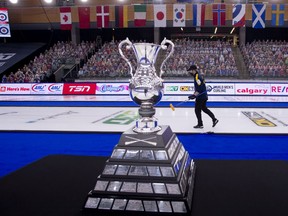 The world men’s curling championship is seen at the Markin MacPhail Centre in Calgary with Sweden’s Niklas Edin, skip of the winning team, in the background on Sunday, April 11, 2021.