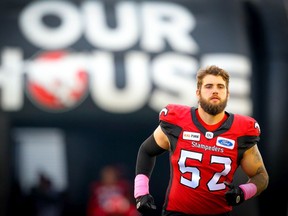 The Calgary Stampeders’ Riley Jones runs onto before facing the Winnipeg Blue Bombers at McMahon Stadium in Calgary on Saturday, October 19, 2019.