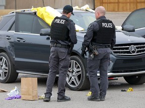 Calgary police investigate after two people were killed in a parking lot at 37th ave. and Barlow Trail N.E. early Wednesday morning in Calgary on Wednesday, April 3, 2019.