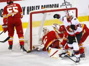Calgary Flames goalie Jacob Markstrom is scored on by the Ottawa Senators’ Connor Brown at the Scotiabank Saddledome in Calgary on Monday, April 19, 2021.