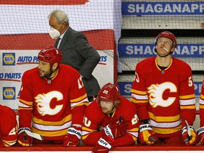 Calgary Flames players react as they lose 2-1 to the Montreal Canadiens in NHL action at the Scotiabank Saddledome in Calgary on Monday, April 26, 2021. On Monday night, they watched helplessly as the Canadiens eliminated them from playoff contention. Darren Makowichuk/Postmedia