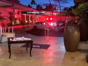 Emergency response vehicle is seen at Kahala Resort & Hotel in Honolulu, Hawaii, U.S., April 10, 2021 in this still image obtained from social media video.