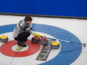 Bruce Mouat holds the broom during the Pinty's Grand Slam of Curling Humpty's Champions Cup at WinSport's Markin MacPhail Centre in Calgary. Mike Cleasby/Grand Slam of Curling