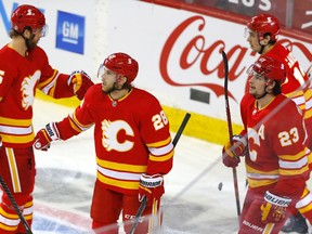 Calgary Flames Elias Lindholm scores on Winnipeg Jets goalie Connor Hellebuyck in first period NHL action at the Scotiabank Saddledome in Calgary on Monday, March 29, 2021. Darren Makowichuk/Postmedia