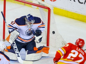 Edmonton Oilers goalie Mike Smith makes a save on Josh Leivo of the Calgary Flames in this photo from March 15.