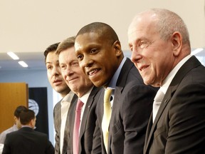 Toronto Raptors president Masai Ujiri (second from right) and MLSE CEO Larry Tanenbaum (right).