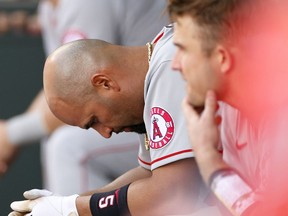 SEATTLE, WASHINGTON - MAY 02: Albert Pujols #5 of the Los Angeles Angels sits in the dugout during the game against the Seattle Mariners at T-Mobile Park on May 02, 2021 in Seattle, Washington.