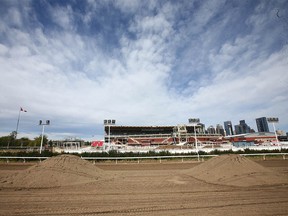 Piles of dirt sits on the the backstretch of the track at the infield area at the Stampede grounds in Calgary on Thursday, May 27, 2021. The chuckwagon races have been cancelled for the 2021 Stampede.
