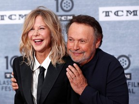 Cast members Billy Crystal and Meg Ryan pose as they arrive for the 30th anniversary screening of comedy movie "When Harry Met Sally..." in Hollywood, Calif., April 11, 2019.