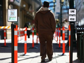 Calgarians head into the COVID-19 vaccination clinic in downtown Calgary on Monday, May 10, 2021. Eligibility opened to any Albertan born in 2009 or earlier on Monday.