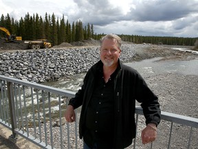 Dick Koetsier, Developer of Gateway Village, poses for a photo near the future development. Gateway Village is a large development that will include a hotel, conference centre, shops, housing and provide a common space in Bragg Creek for festivals and events. Tuesday, May 11, 2021.