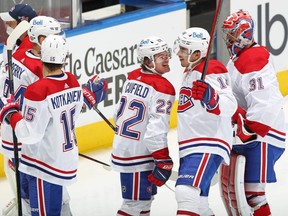 Nick Suzuki, 14, and Cole Caufield, 22, of the Montreal Canadiens celebrate Suzuki's overtime winner against the Maple Leafs in Game 5. GETTY IMAGES