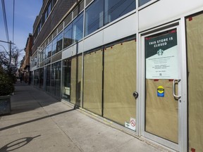 A closed Starbucks coffee shop on Queen St. W., at Ossington Ave., in Toronto, Ont. is pictured on Tuesday March 9, 2021.
