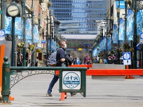 A sign along Stephen Avenue mall in downtown Calgary as COVID cases continue to rise on Monday, May 3, 2021.