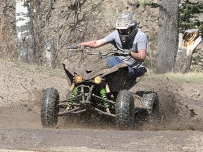 File photo: Gage Niven is seen riding his ATV as Albertans are out enjoying the May Long Weekend on their mud-kicking dirt bikes, ATV's and trucks at Mclean Creek Provincial Recreation Area Saturday, May 16, 2020.
