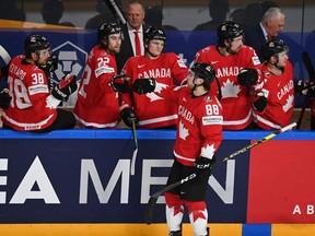 Canada's Andrew Mangiapane celebrates with teammates scoring during the IIHF Men's Ice Hockey World Championships preliminary round group B match Canada vs Norway, at the Arena Riga in Riga, on May 26, 2021.