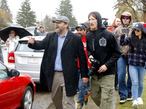 Police address Artur Pawlowski at his S.E. church who was holding a rally to stop the church shut downs and where told to go away in Calgary on Saturday, May 8, 2021.