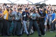 Phil Mickelson is assisted by security as he is followed up the 18th fairway by a gallery of fans after hitting his approach shot during the final round of the 2021 PGA Championship held at the Ocean Course of Kiawah Island Golf Resort on May 23, 2021 in Kiawah Island, South Carolina.