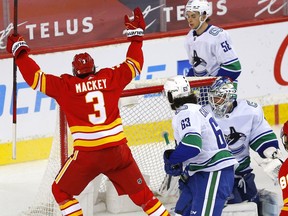 Calgary Flames Connor Mackey scores on Vancouver Canucks goalie Braden Holtby in third NHL action at the Scotiabank Saddledome in Calgary on Wednesday, May 19, 2021. Darren Makowichuk/Postmedia