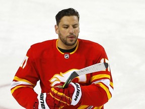 Calgary Flames Milan Lucic is honoured for his 1000th NHL game before taking on the Ottawa Senators in NHL action at the Scotiabank Saddledome in Calgary on Monday, April 19, 2021. Darren Makowichuk/Postmedia