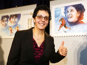 Olympic Womens Hockey, Danielle Goyette checks out her stamp as Canada Post unveiled five stamps to honour six barrier breaking role models at Canada's Sports Hall of Fame in Calgary, Alta., on Wednesday, January 24, 2018. Darren Makowichuk/Postmedia