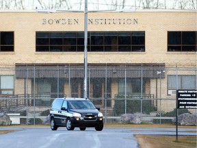 A corrections van drives on the main the entranceway to the Bowden Institution.