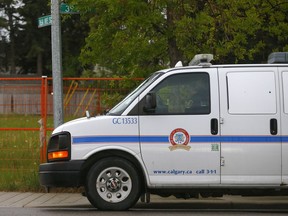 EMS and bylaw at scene of a dog bite at 15th Avenue and 39th Street S.W. after two people where attacked by a pitbull in Calgary on Sunday, June 6, 2021.