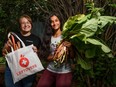 Syma Habib, volunteer, and Shelby Montgomery, VP program with Leftover Foundation, pose for a photo at Habib's backyard with her fresh cut rhubarb on Friday, June 25, 2021. Through the Leftover Foundation app, Calgarians can donate the fruits and vegetables they grow in their backyard gardens to service agencies and connect with volunteers to help harvest it.