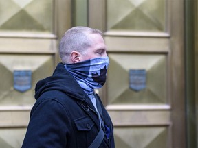 Const. Alexander Dunn, the police officer convicted of assault for slamming Dalia Kafi to the floor, walks out of Calgary Courts Centre on Wednesday, Oct. 28, 2020.