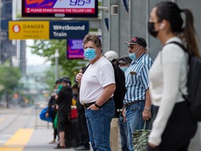 Calgarians ride the CTrain in downtown Calgary on Sunday, June 20, 2021.