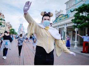 A visitor wears a protective mask at Disneyland Paris as the theme park reopens its doors to the public in Marne-la-Vallee, June 17, 2021.