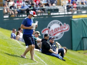 Baseball fans celebrate Father's Day at Seaman Stadium watching the Okotoks Dawgs take on the Lethbridge Bulls in Okotoks on Sunday, June 20, 2021.