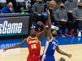 Philadelphia 76ers center Joel Embiid (21) and Atlanta Hawks center Clint Capela (15) tip off at Wells Fargo Center.