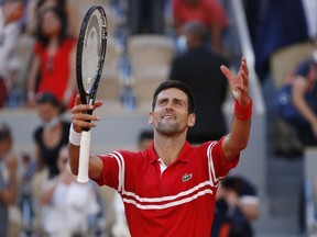 Serbia's Novak Djokovic celebrates winning the French Open final against Greece's Stefanos Tsitsipas in Paris, June 13, 2021.