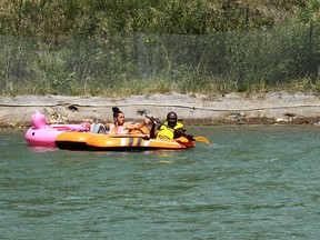 Tubers during a warm day on the Bow River. Thursday, June 17, 2021.