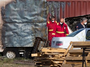 Fire and police investigators examine the scene of an early morning trailer fire that left one person with serious injuries on Tuesday, June 22, 2021. The fire occurred in an industrial yard in the 1200 block of Moraine Road N.E.

Gavin Young/Postmedia