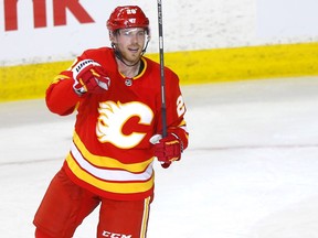 Calgary Flames Elias Lindholm scores on Vancouver Canucks, Thatcher Demko in second period action at the Scotiabank Saddledome in Calgary on Monday, January 18, 2021. Darren Makowichuk/Postmedia