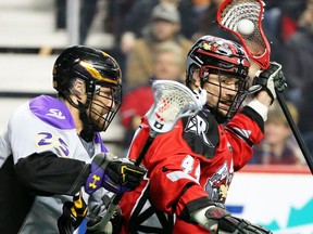 The Calgary Roughnecks Dane Dobbie and the San Diego Seals Eli Gobrecht jostle during National Lacrosse League action in Calgary on Saturday, February 29, 2020.  Gavin Young/Postmedia
