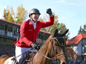 Belgium's Francois Jr Mathy celebrates on his mount Uno De La Roque after clinching the gold medal in the second round of the BMO Nations' Cup in the International Ring during The Masters show jumping event at Spruce Meadows in Calgary on Saturday, September 7, 2019. Jim Wells/Postmedia