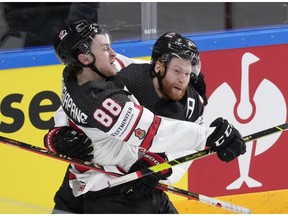 Calgary Flames' Andrew Mangiapane celebrates scoring Canada's third goal with teammate during world championship action in Europe last week.