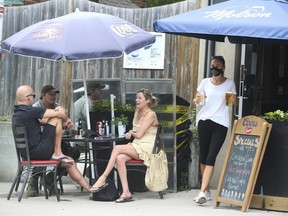 People were out and about enjoying patio life at The Fill Station on Queen St. E. in the Beach observing all of the COVID rules and regulations on Saturday, June 19, 2021.