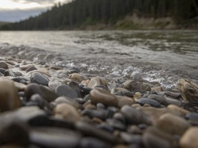Highway water splashes on rocks along the Bow River downstream from Calgary, Ab., on Tuesday, June 8, 2021. Mike Drew/Postmedia
