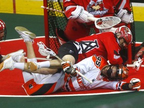 The Calgary Roughnecks' Jesse King battles the Buffalo Bandits' Chase Fraser in Game 2 of the 2019 NLL  Finals at the Scotiabank Saddledome  in this photo from May 25, 2019.