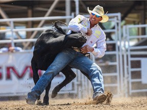 Cody Cassidy, of Donalda, Alta., wins the steer wrestling event on the ninth day of the Calgary Stampede on Saturday, July 17, 2021.