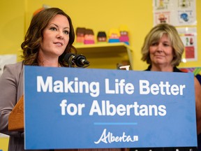 Rebecca Schulz, Minister of Children’s Services, speaks at a press conference regarding additional support for affordable child care while Whitney Issik, Associate Minister of Status of Women, stands beside her at A Child First Preschool on Monday, July 26, 2021.