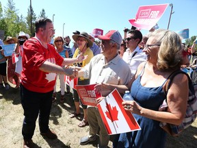 Alberta Premier Jason Kenny arrives for a Canada Day event in Parkland in southeast Calgary on Thursday, July 1, 2021.