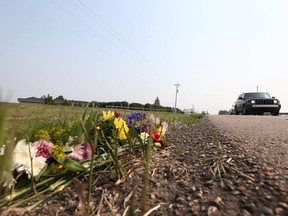 Flowers are shown on the side of the road at the scene of a fatal accident on Thursday, July 15, 2021. The accident, occurred early on Thursday morning on Range Road 32, west of Calgary, near the Springbank airport. Jim Wells/Postmedia