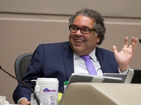 Calgary Mayor Naheed Nenshi smiles during the council vote to rescind the mandatory masking bylaw in the city. Mandatory masking for transit and inside city owned and operated facilities will remain for the time being. Council voted on Monday, July 5, 2021.