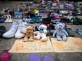 The memorial to children who died at residential schools in Canada continued to grow outside Calgary City Hall on Monday, July 5, 2021.